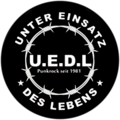 U.E.D.L. Unter Einsatz des Lebens Motiv 1 Anstecker mit Sicherheitsnadel Ø 25 mm